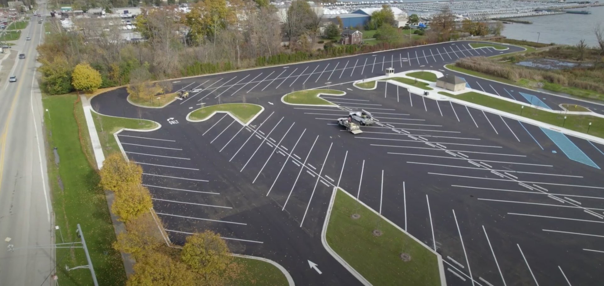 Commercial Landscaping Project - Sustainable Design and Professional Installation by Maywood Landscaping Aerial view of commercial parking lot with professional landscaping islands and sustainable design elements
